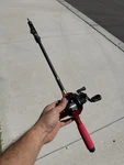 Runcl Merced Baitcasting Fishing Reel, Right, Red With Collapse Pole. Fixed Price $30.00.